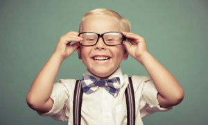 smiling boy in glasses