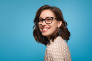 smiling woman in glasses